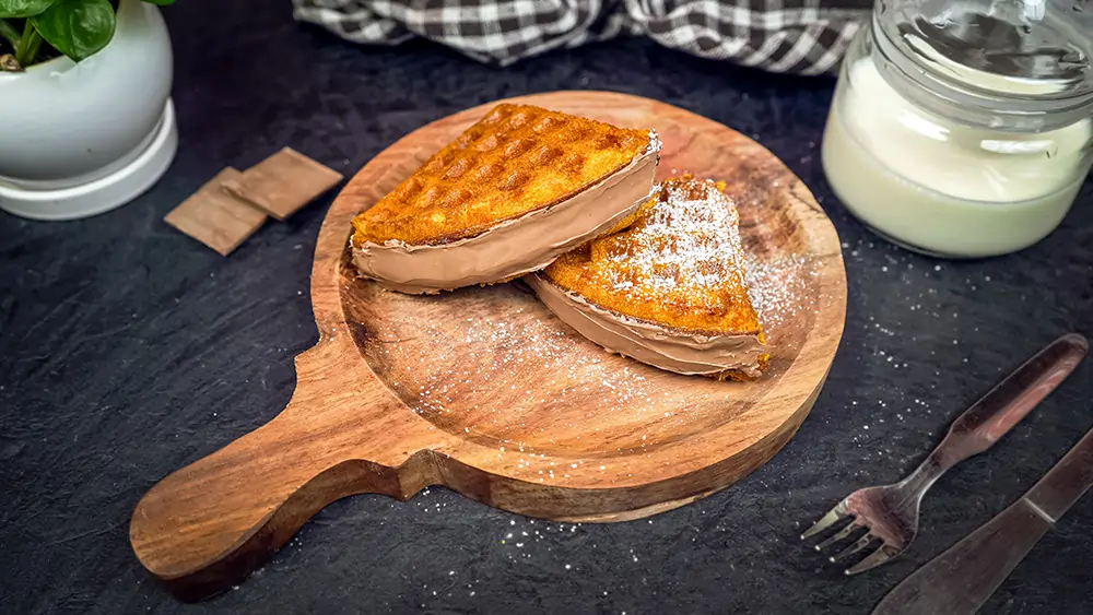 Golden crispy waffles on plate